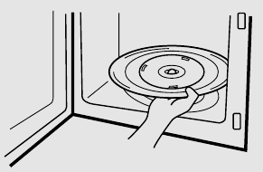 afbeelding van de bodem van de magnetron met de rolgeleider en de glazen draaischijf