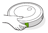 De knop voor het losmaken van de bak bevindt zich aan de achterkant van de robot