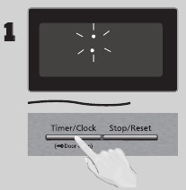 Druk twee keer op Timer/Clock, de dubbele punt knippert