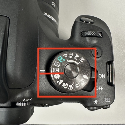 Modusknop van de Canon EOS 2000D ingesteld op Creative Auto